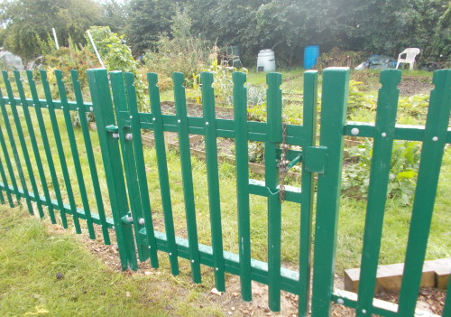 Green palisade fence