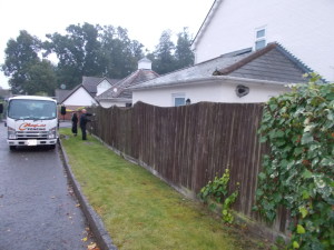 Before shot of old brown fence