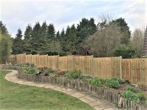 Close Board Fence with Concrete Posts and Gravel Boards